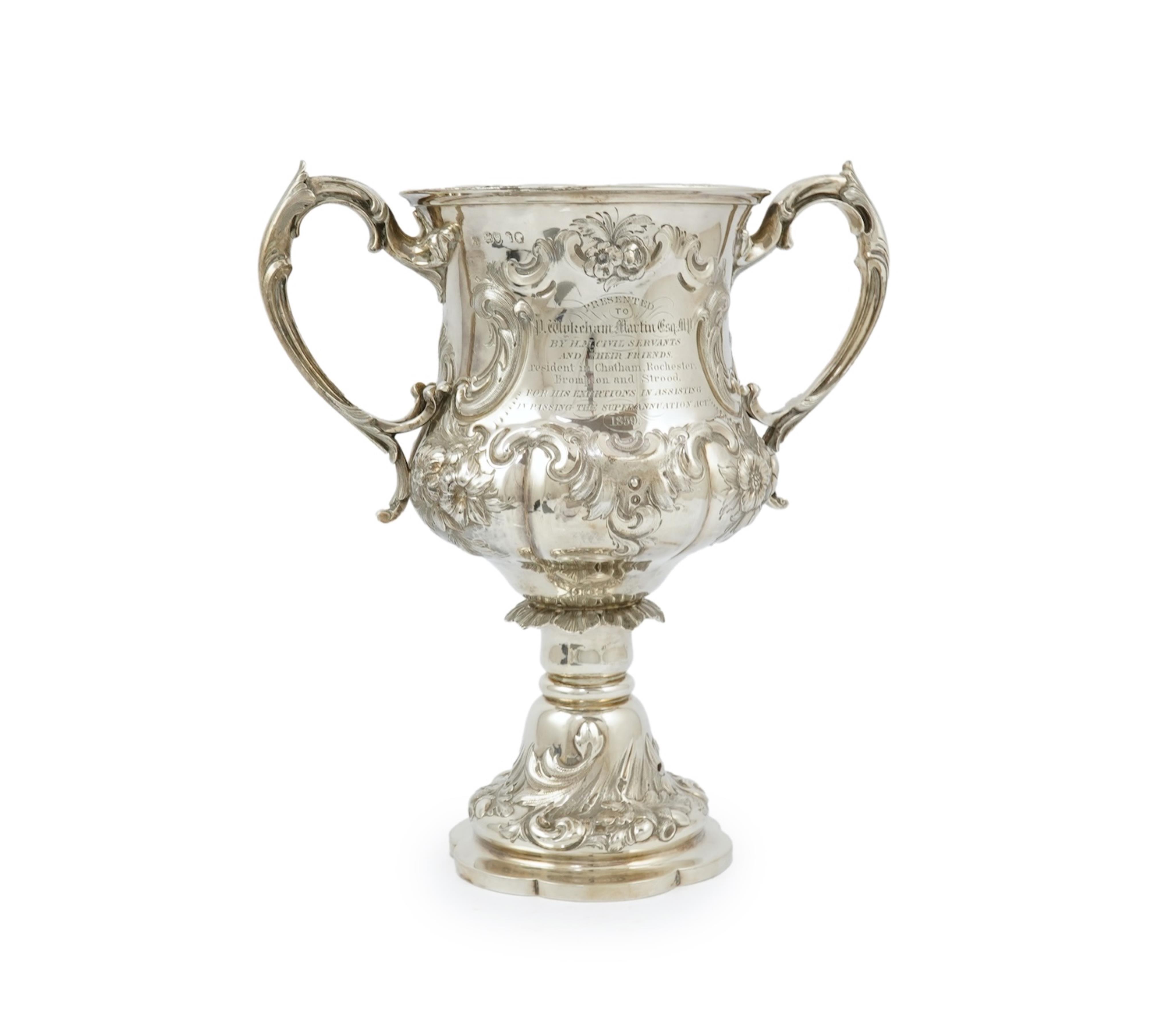 A Victorian embossed silver two handled presentation trophy cup by George John Richards & Edward Charles Brown